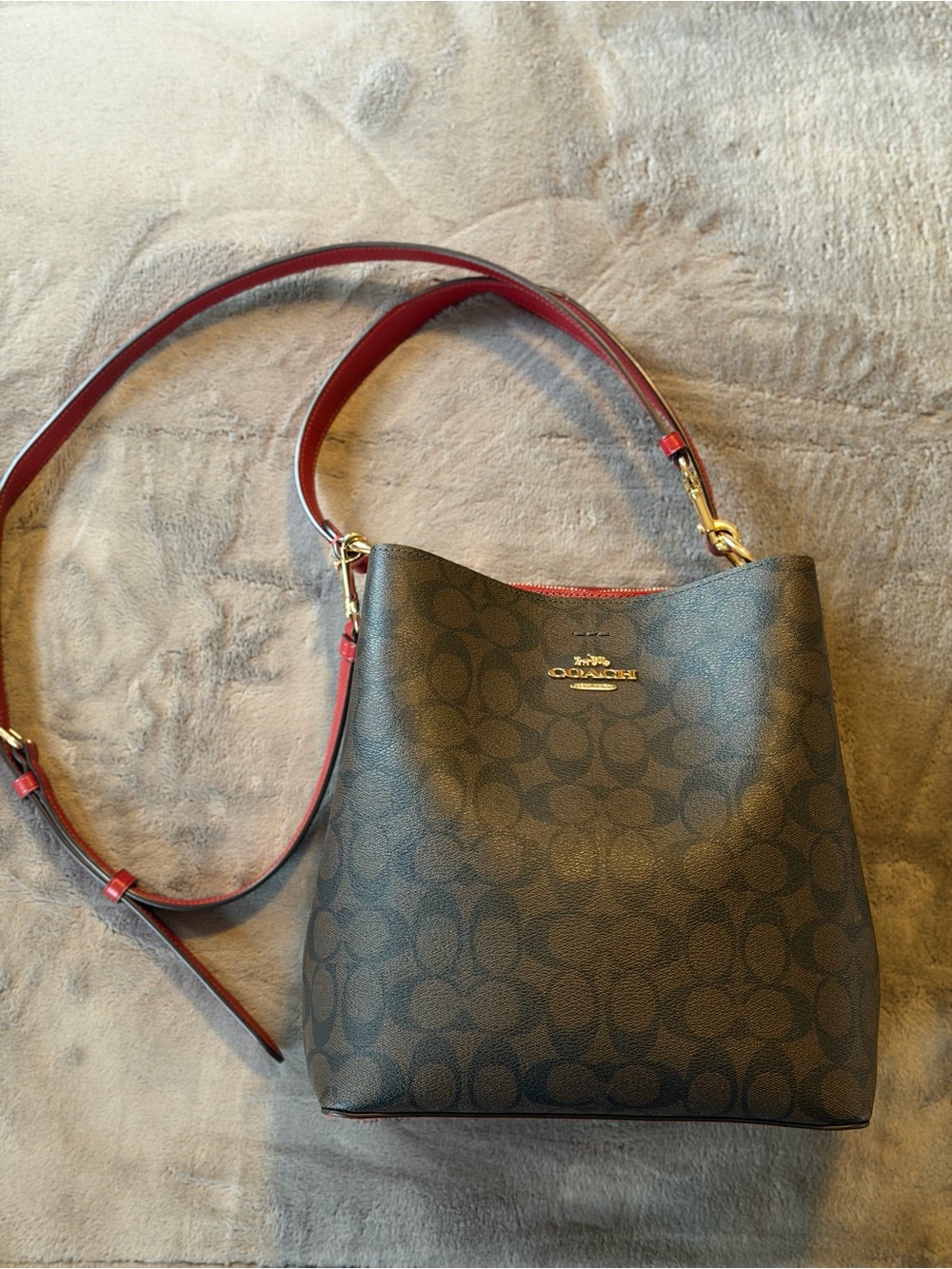 Coach Mollie Bucket Bag 22 in Signature Canvas in a dark brown with red accents